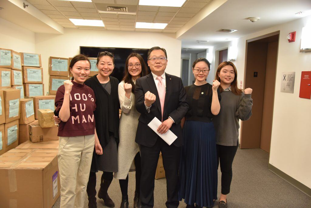 A group of people posing for the camera</p>
<p>Description automatically generated