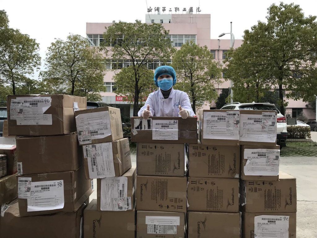 A picture containing outdoor, box, man, cart</p>
<p>Description automatically generated