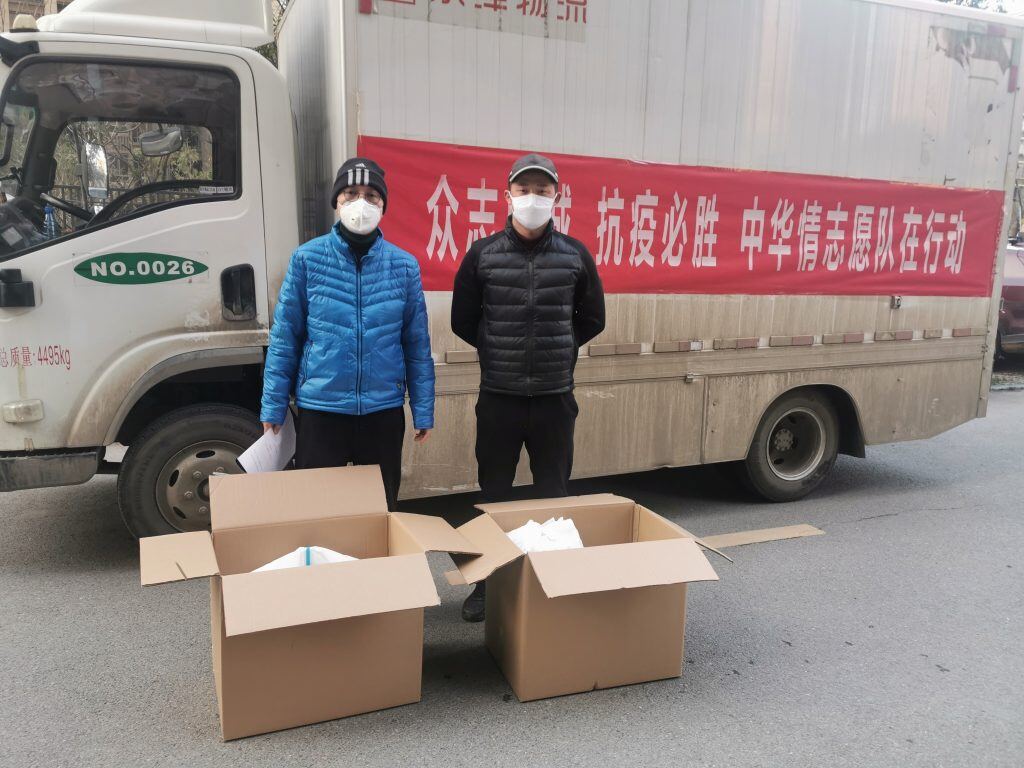 A person standing in front of a truck</p>
<p>Description automatically generated